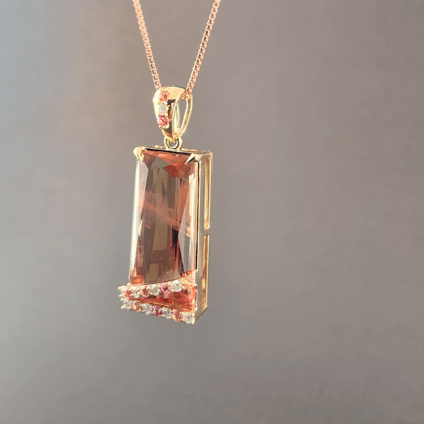 20.60 ct Oregon Sunstone Pendant 14 kt Yellow Gold with Sapphires and Diamonds.