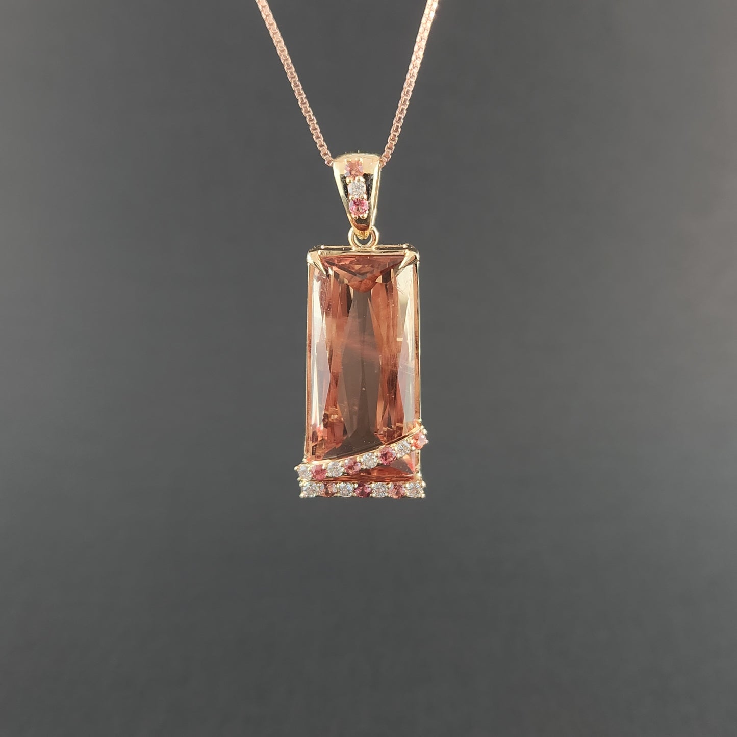 20.60 ct Oregon Sunstone Pendant 14 kt Yellow Gold with Sapphires and Diamonds.