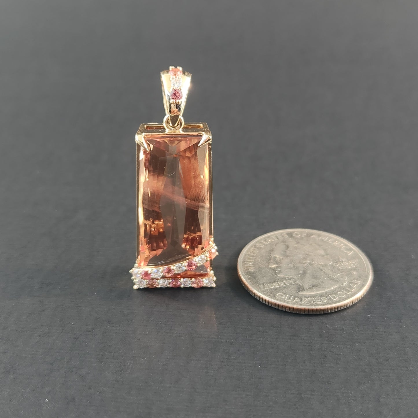 20.60 ct Oregon Sunstone Pendant 14 kt Yellow Gold with Sapphires and Diamonds.