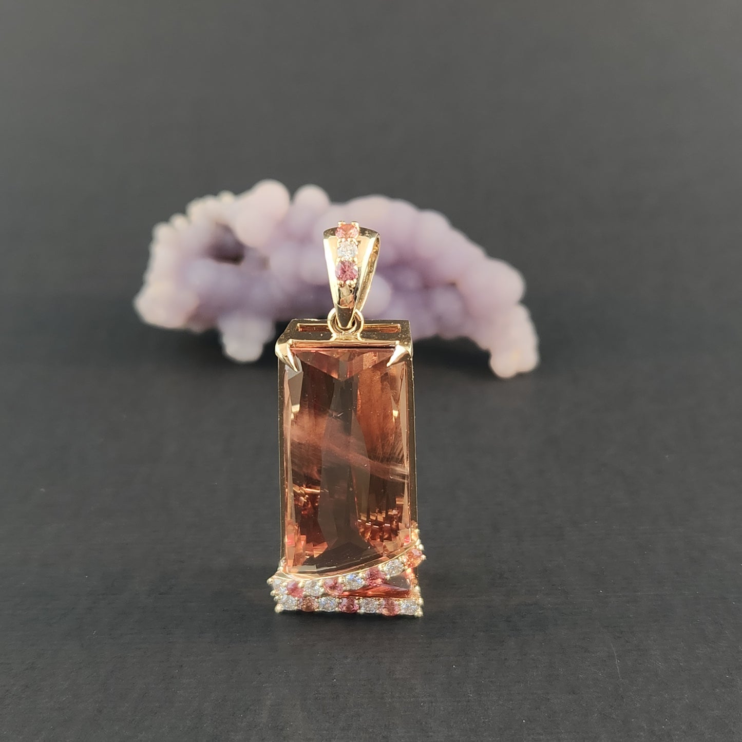 20.60 ct Oregon Sunstone Pendant 14 kt Yellow Gold with Sapphires and Diamonds.