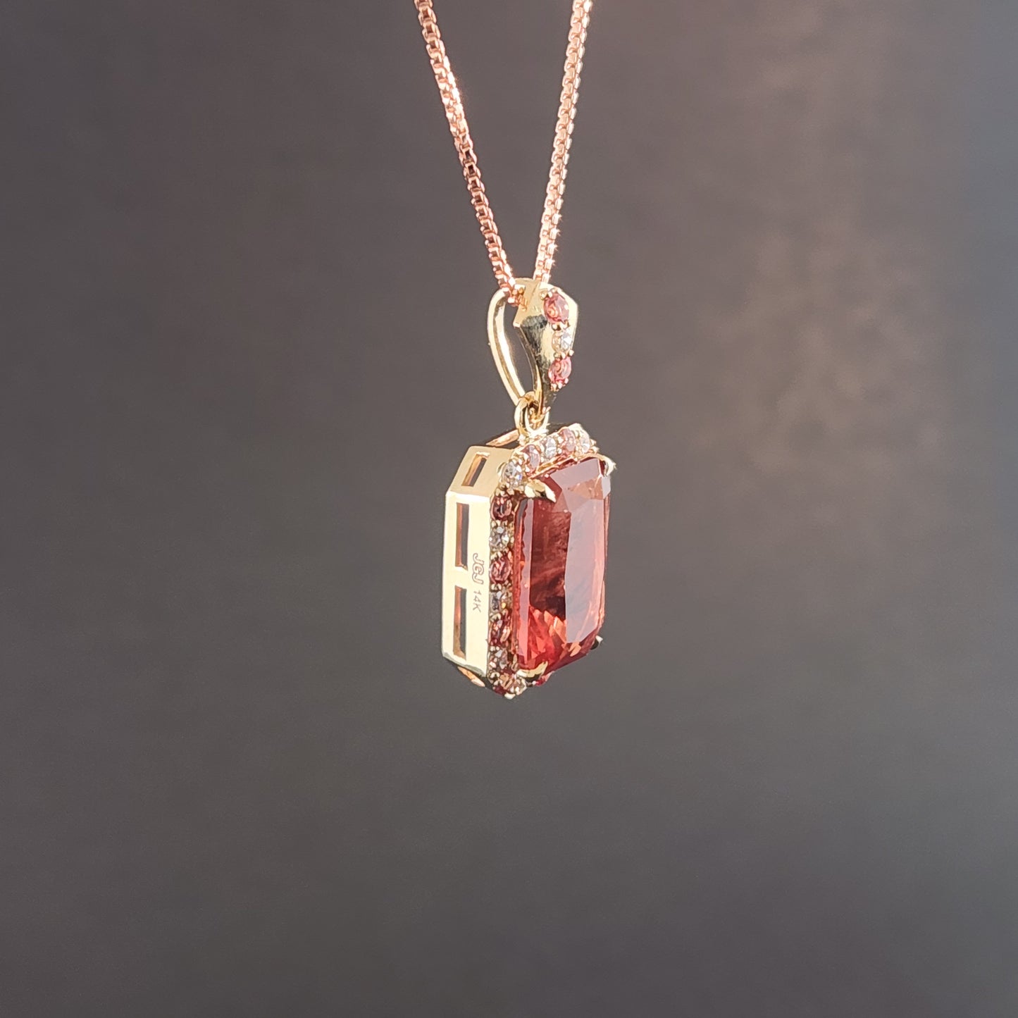 5.02 ct Oregon Sunstone Pendant set in 14 kt yellow gold with sapphires and Diamonds.