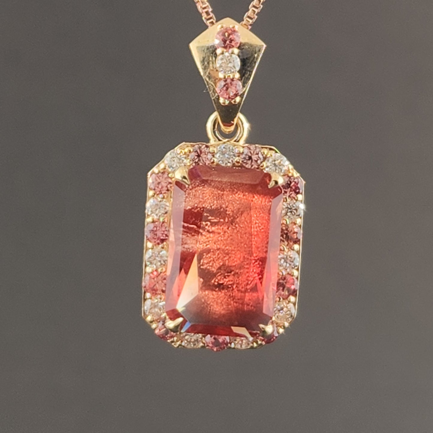 5.02 ct Oregon Sunstone Pendant set in 14 kt yellow gold with sapphires and Diamonds.