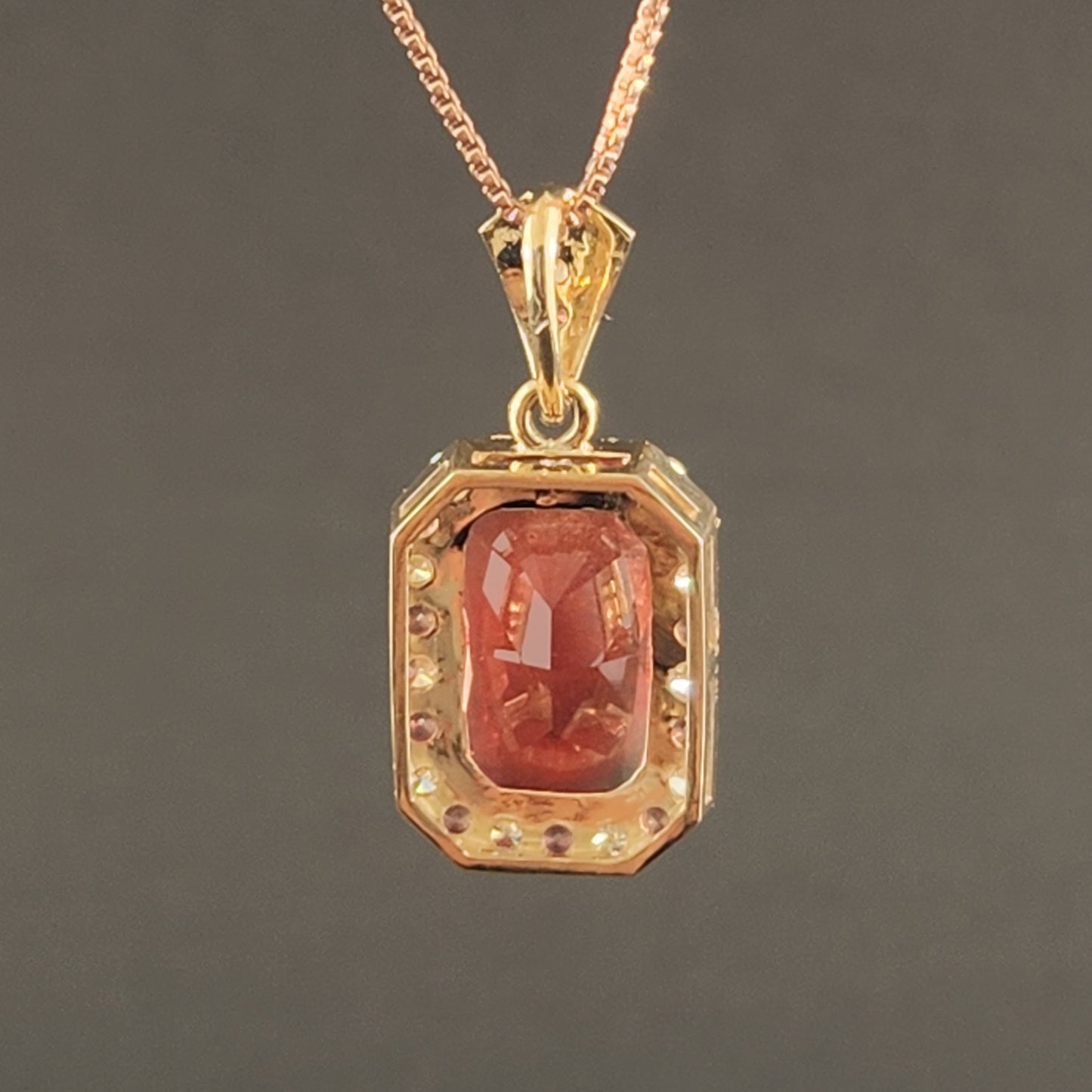5.02 ct Oregon Sunstone Pendant set in 14 kt yellow gold with sapphires and Diamonds.