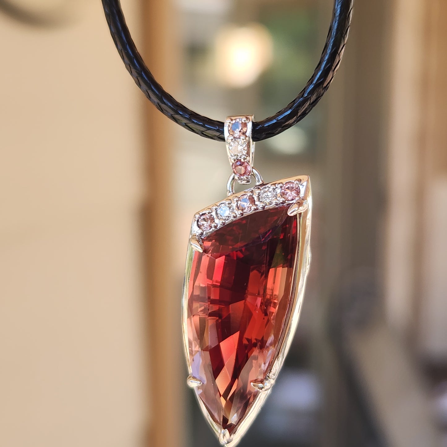 15.22 ct Oregon Sunstone Pendant set in 14 kt Gold with Sapphires and diamonds.