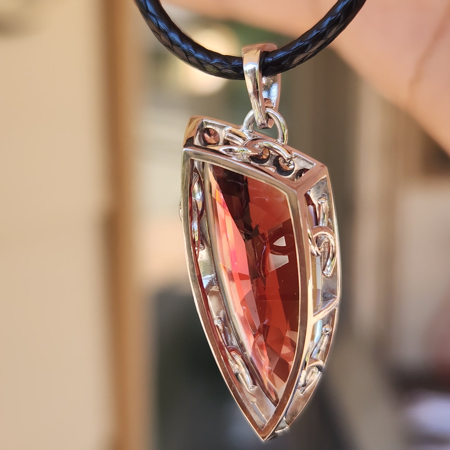 15.22 ct Oregon Sunstone Pendant set in 14 kt Gold with Sapphires and diamonds.