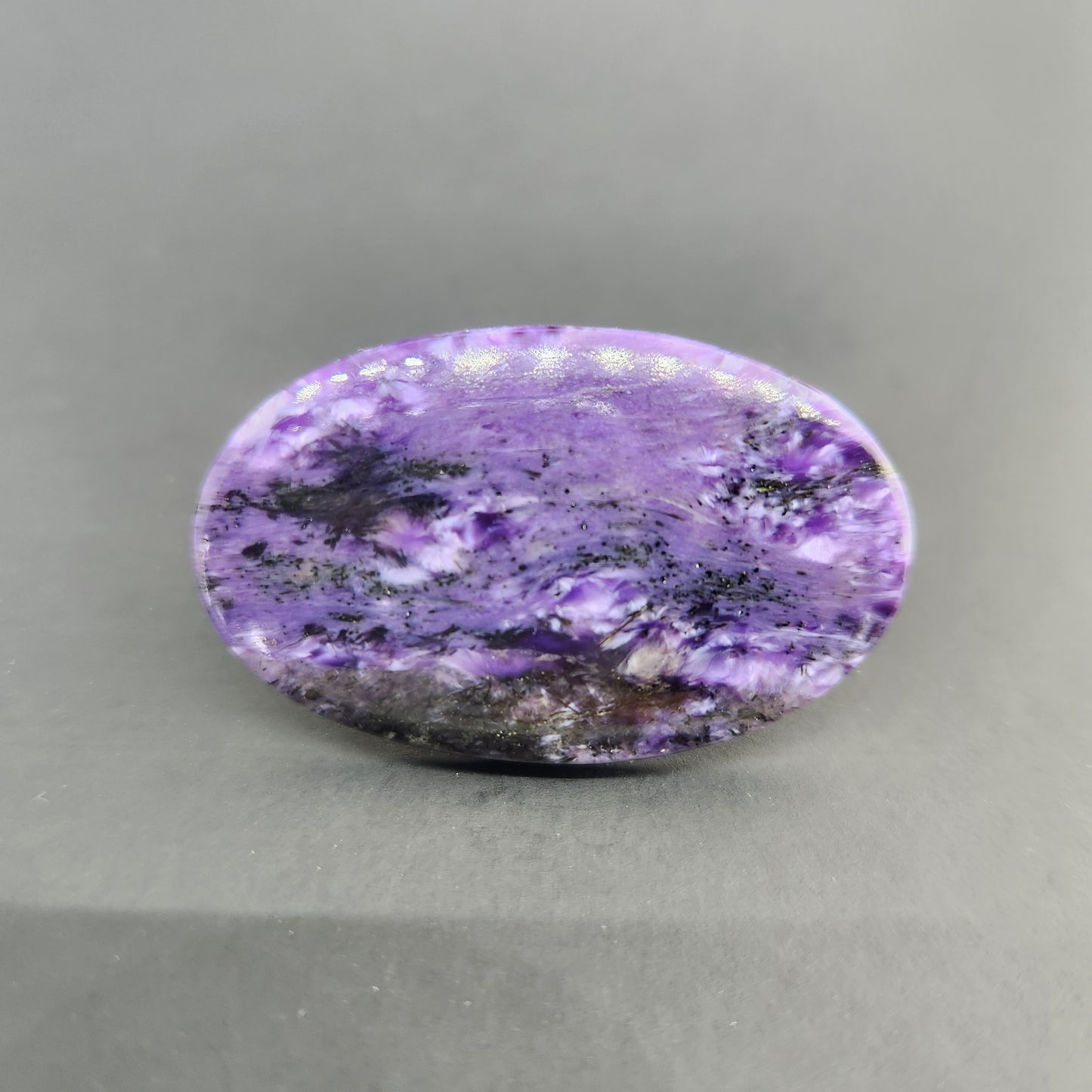 11.73 g Charoite Cabochon.