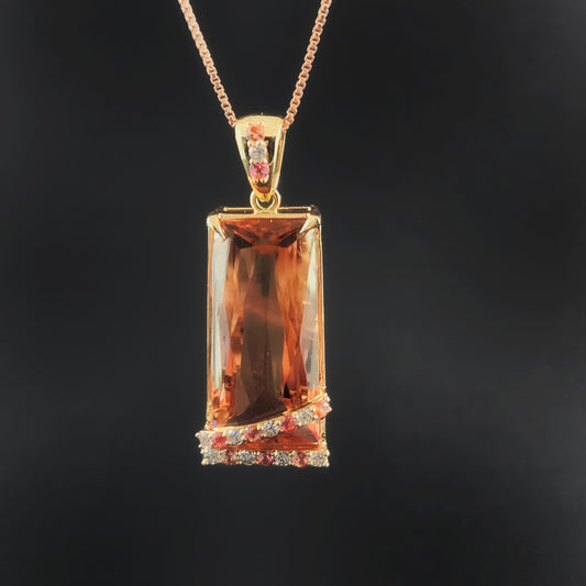 20.60 ct Oregon Sunstone Pendant 14 kt Yellow Gold with Sapphires and Diamonds.