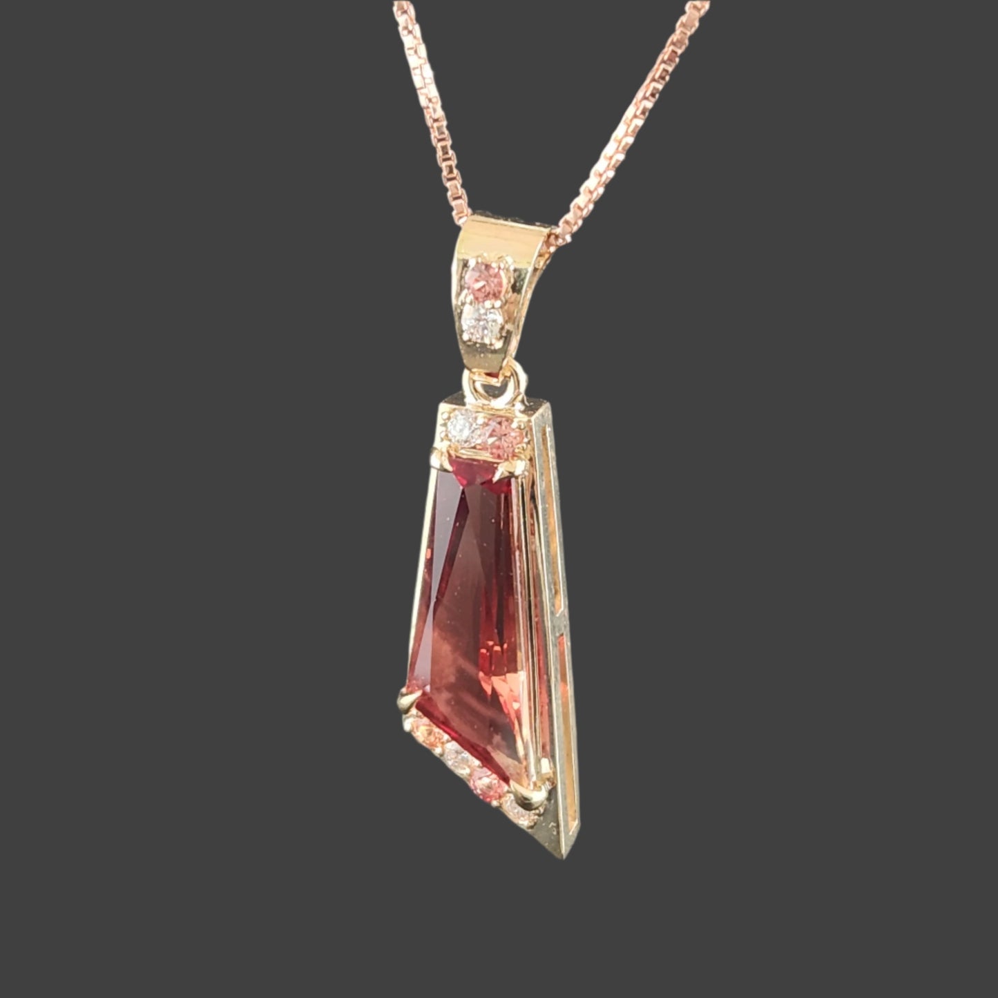 2.89 ct Oregon Sunstone Pendant set in 14 kt yellow Gold with Sapphires and Diamonds.