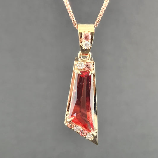 2.89 ct Oregon Sunstone Pendant set in 14 kt yellow Gold with Sapphires and Diamonds.