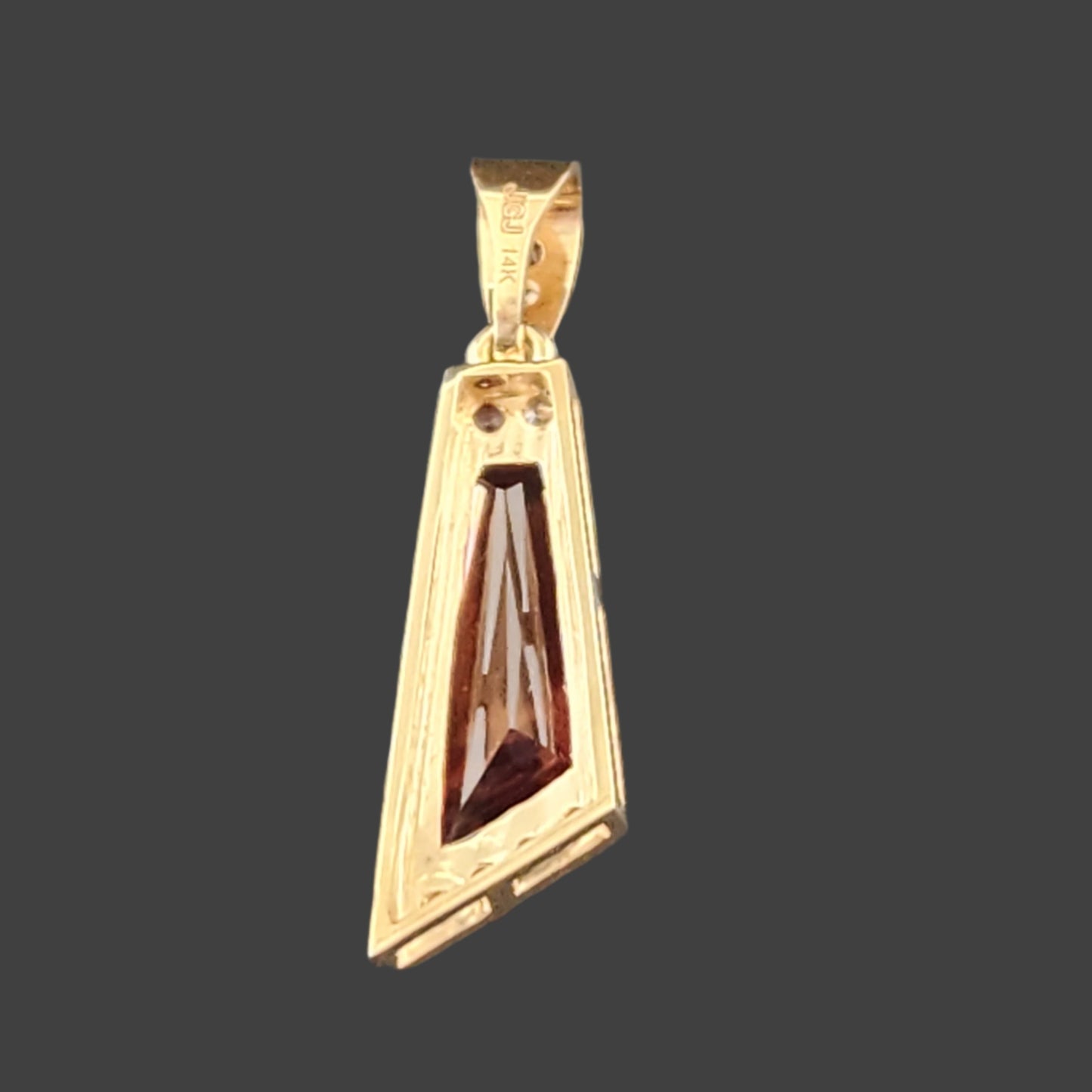 2.89 ct Oregon Sunstone Pendant set in 14 kt yellow Gold with Sapphires and Diamonds.