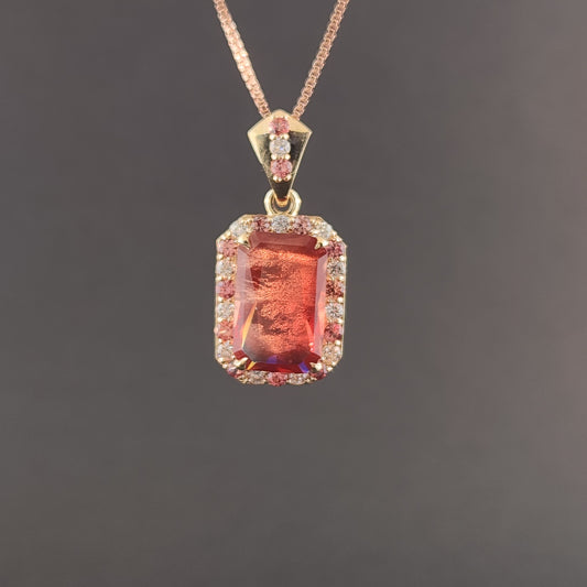 5.02 ct Oregon Sunstone Pendant set in 14 kt yellow gold with sapphires and Diamonds.
