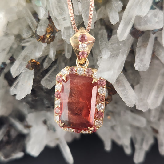 5.02 ct Oregon Sunstone Pendant set in 14 kt yellow gold with sapphires and Diamonds.