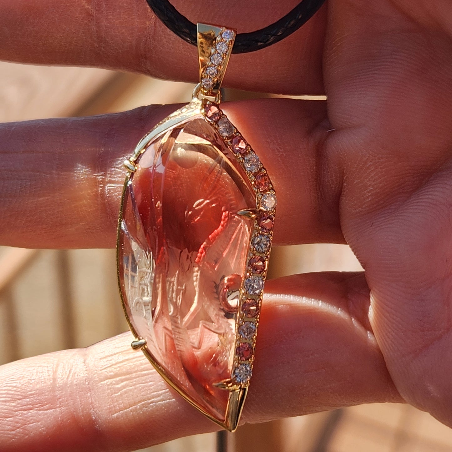23.22 ct Oregon Sunstone Carving Dragon Pendant set in 14 kt Gold.