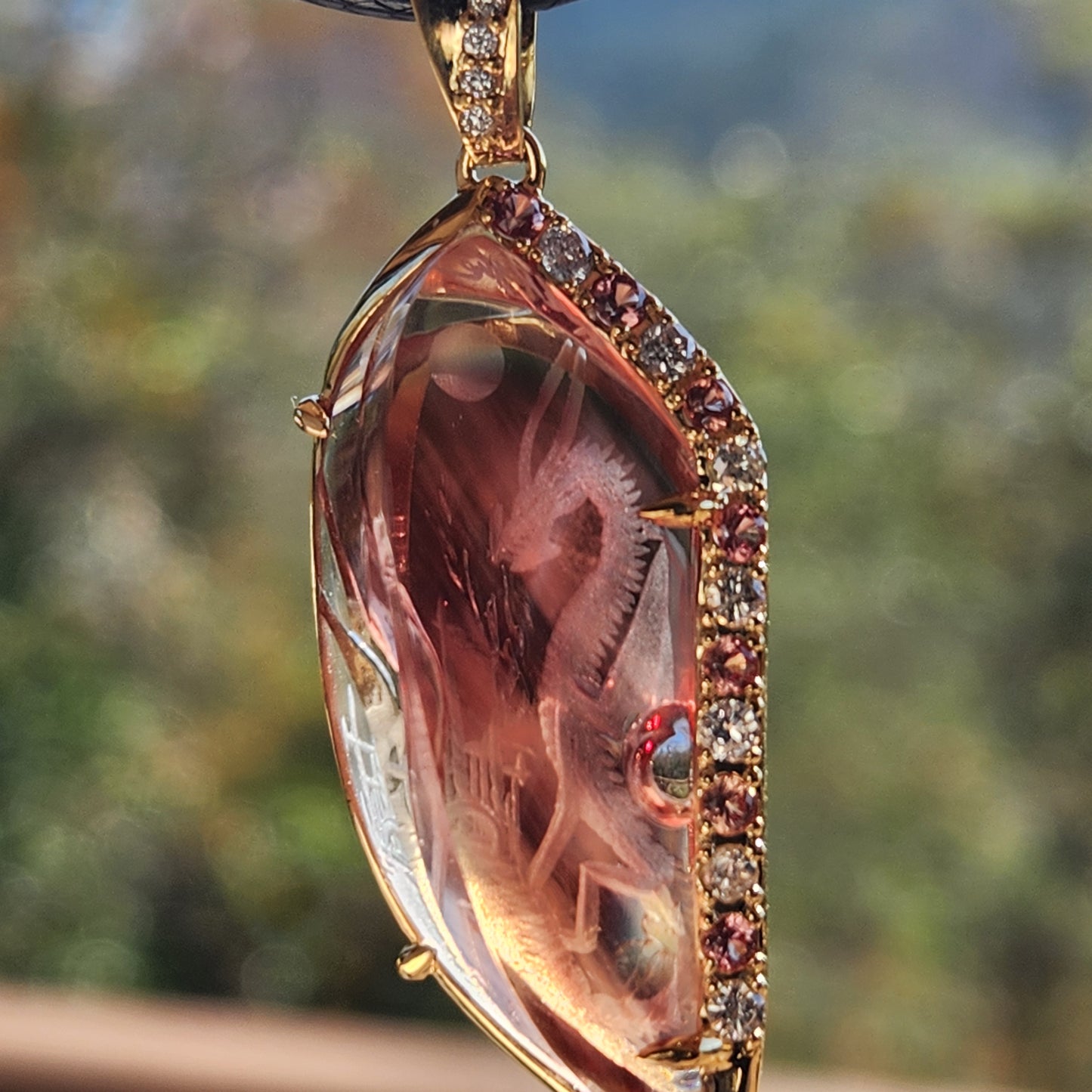 23.22 ct Oregon Sunstone Carving Dragon Pendant set in 14 kt Gold.