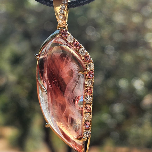 23.22 ct Oregon Sunstone Carving Dragon Pendant set in 14 kt Gold.