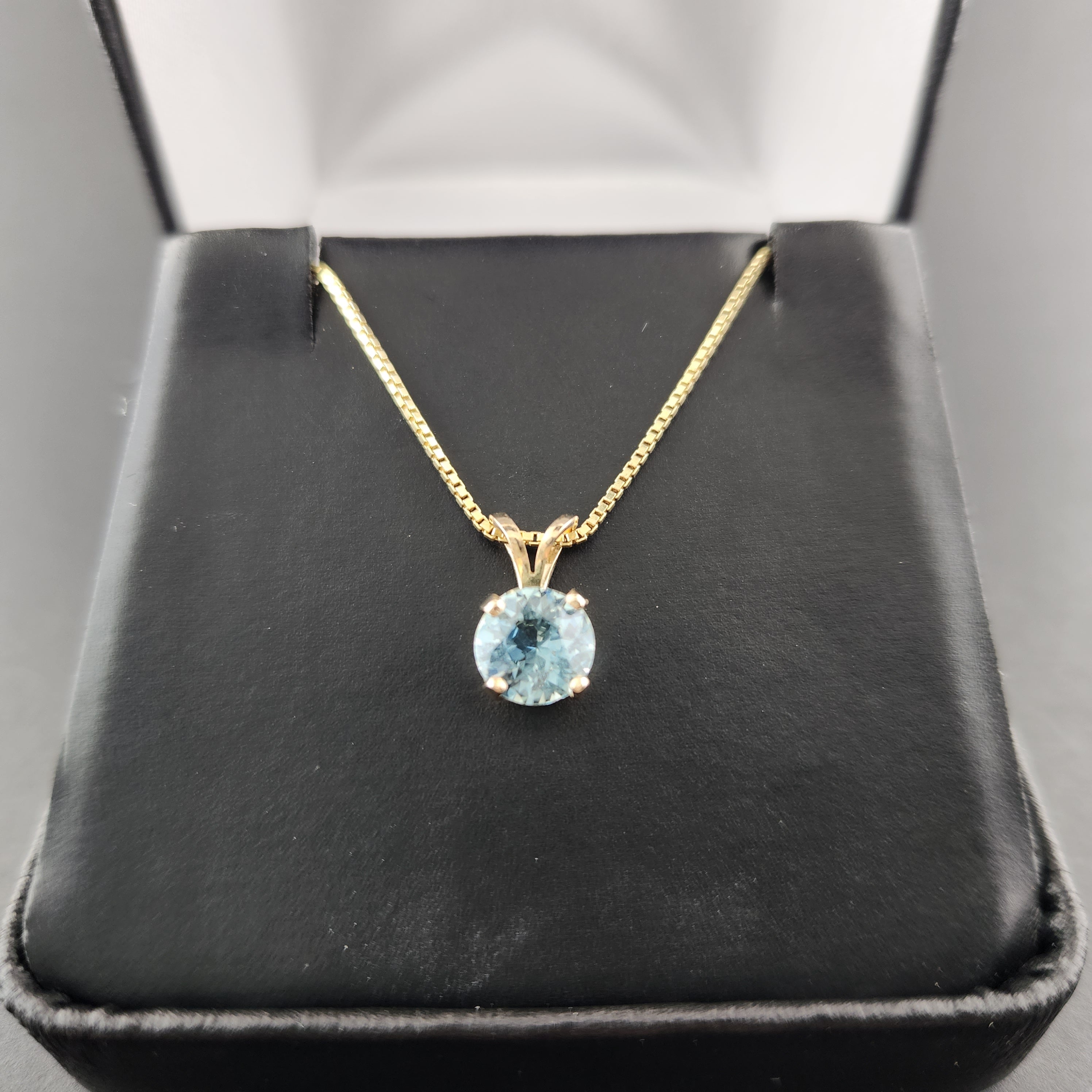 Yellow gold store aquamarine pendant